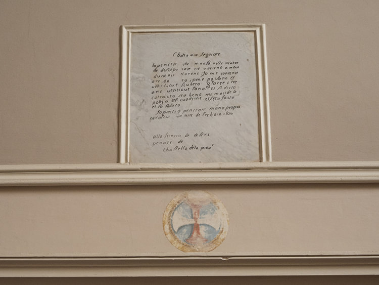 One of Pietro Perugino's letters transferred into the wall.